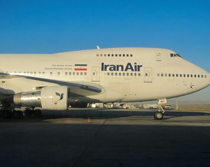a large air plane sitting on top of an airport tarmac
