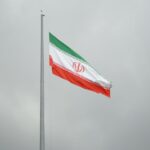 A flag flying in the wind on a cloudy day