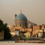 A group of people standing in front of a building
