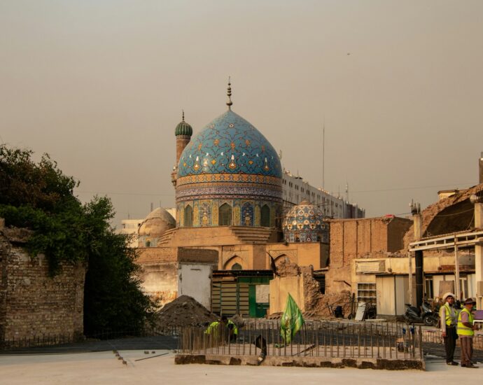 A group of people standing in front of a building