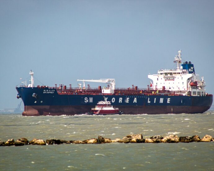 a large cargo ship in the middle of the ocean