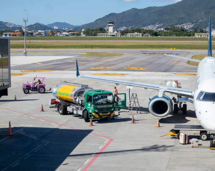 green and yellow truck on airport during daytime