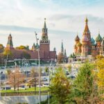 View of St. Basil's Cathedral and Kremlin during a sunny day in Moscow, Russia. Iconic tourist attraction.