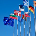 a bunch of flags that are flying in the air