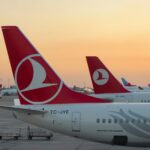 a couple of airplanes at an airport