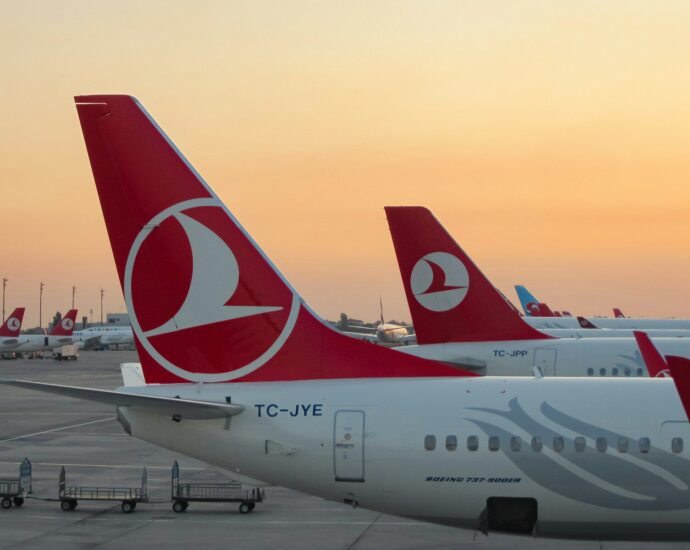 a couple of airplanes at an airport