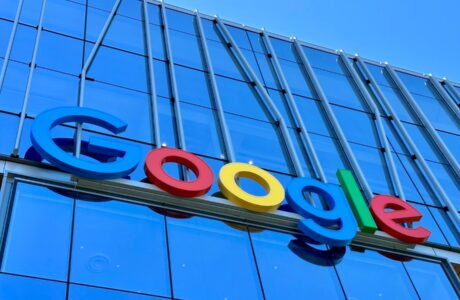 the google logo is displayed on the side of a building