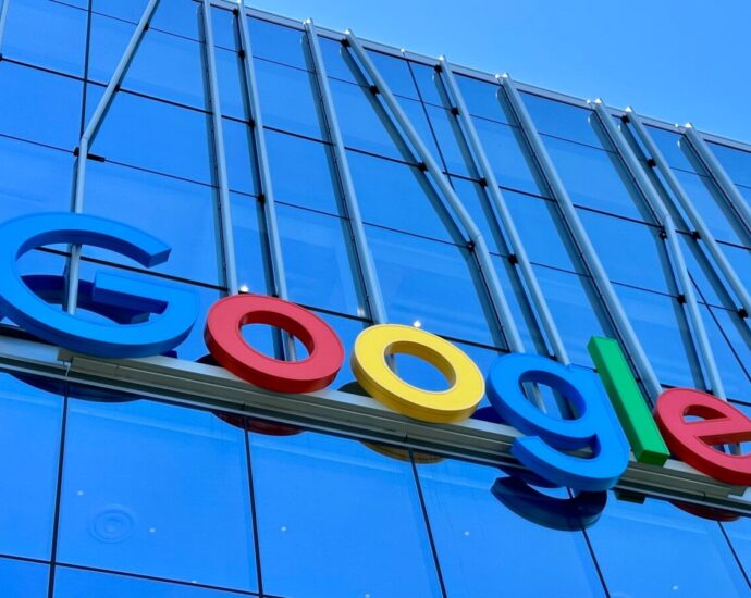 the google logo is displayed on the side of a building