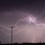 Captivating long exposure shot of a lightning storm over power lines in KwaZulu-Natal, South Africa.
