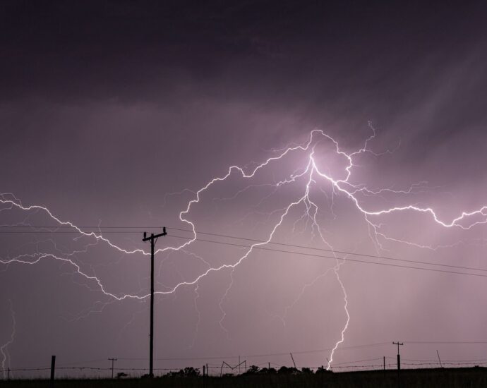 Captivating long exposure shot of a lightning storm over power lines in KwaZulu-Natal, South Africa.