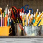 assorted color pencils in yellow bucket
