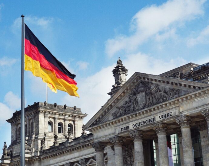 The German flag flying above the Reichstag building in Berlin, Germany.