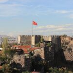 A castle with a flag on top of it