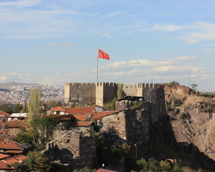 A castle with a flag on top of it