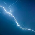 a lightning bolt is seen in the sky