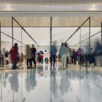 people walking on white floor tiles