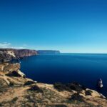 body of water surrounded by rock