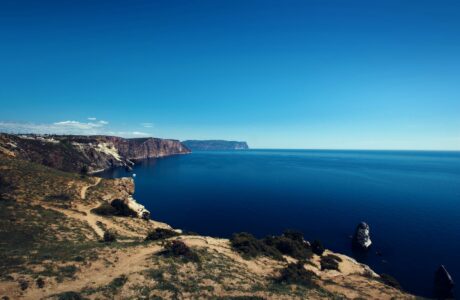 body of water surrounded by rock