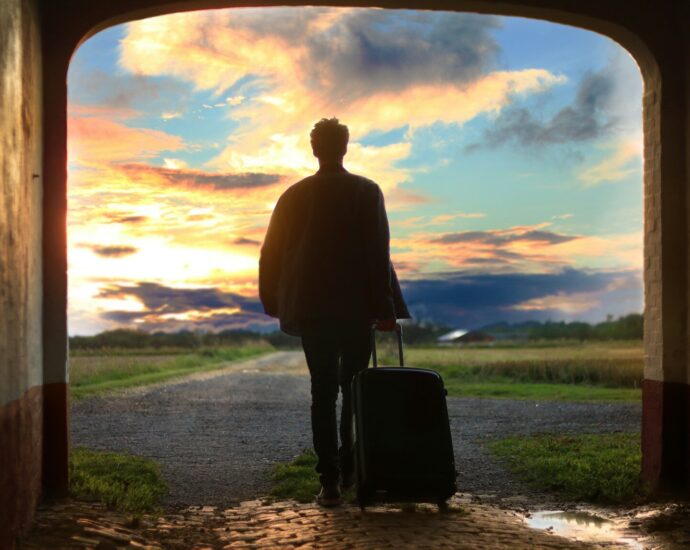 man holding luggage photo