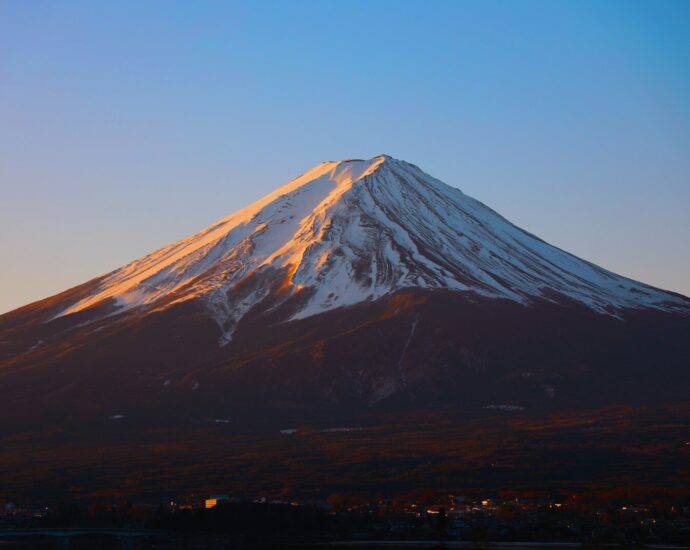 Mount Fuji with snow-covered peak under a clear blue sky in Fujinomiya, Japan