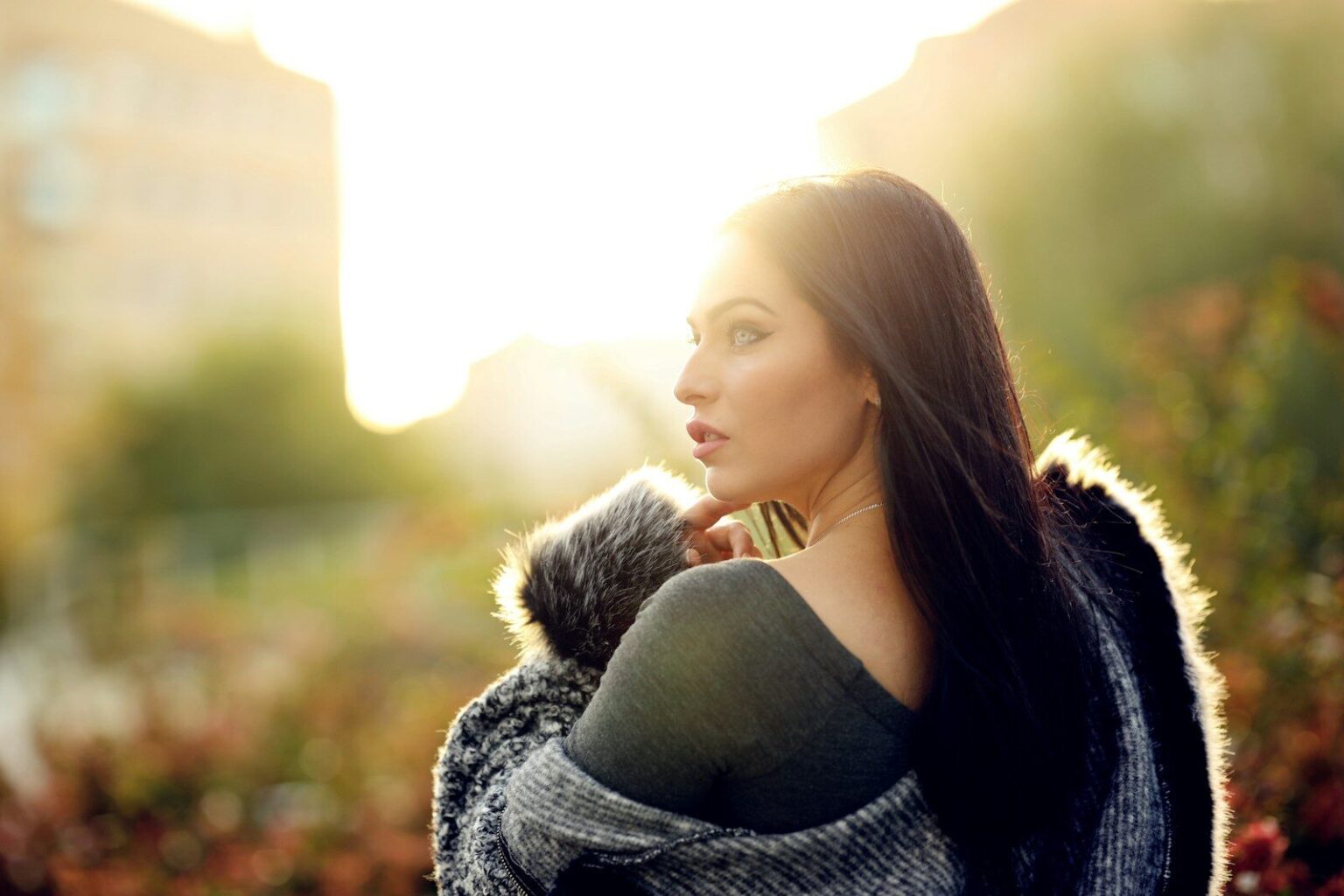 selective focus photography of standing woman wearing gray fur jacket