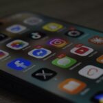 A smartphone screen displaying a grid of colorful social media and utility app icons