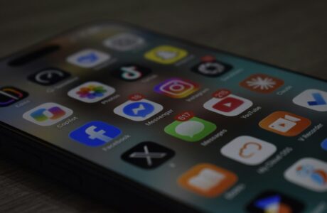 A smartphone screen displaying a grid of colorful social media and utility app icons