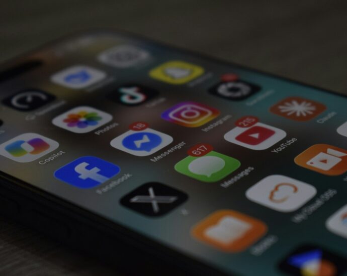 A smartphone screen displaying a grid of colorful social media and utility app icons